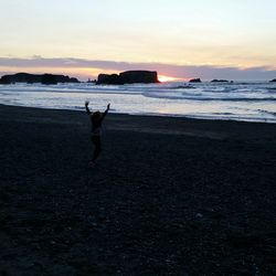 Scenic view of sea at sunset