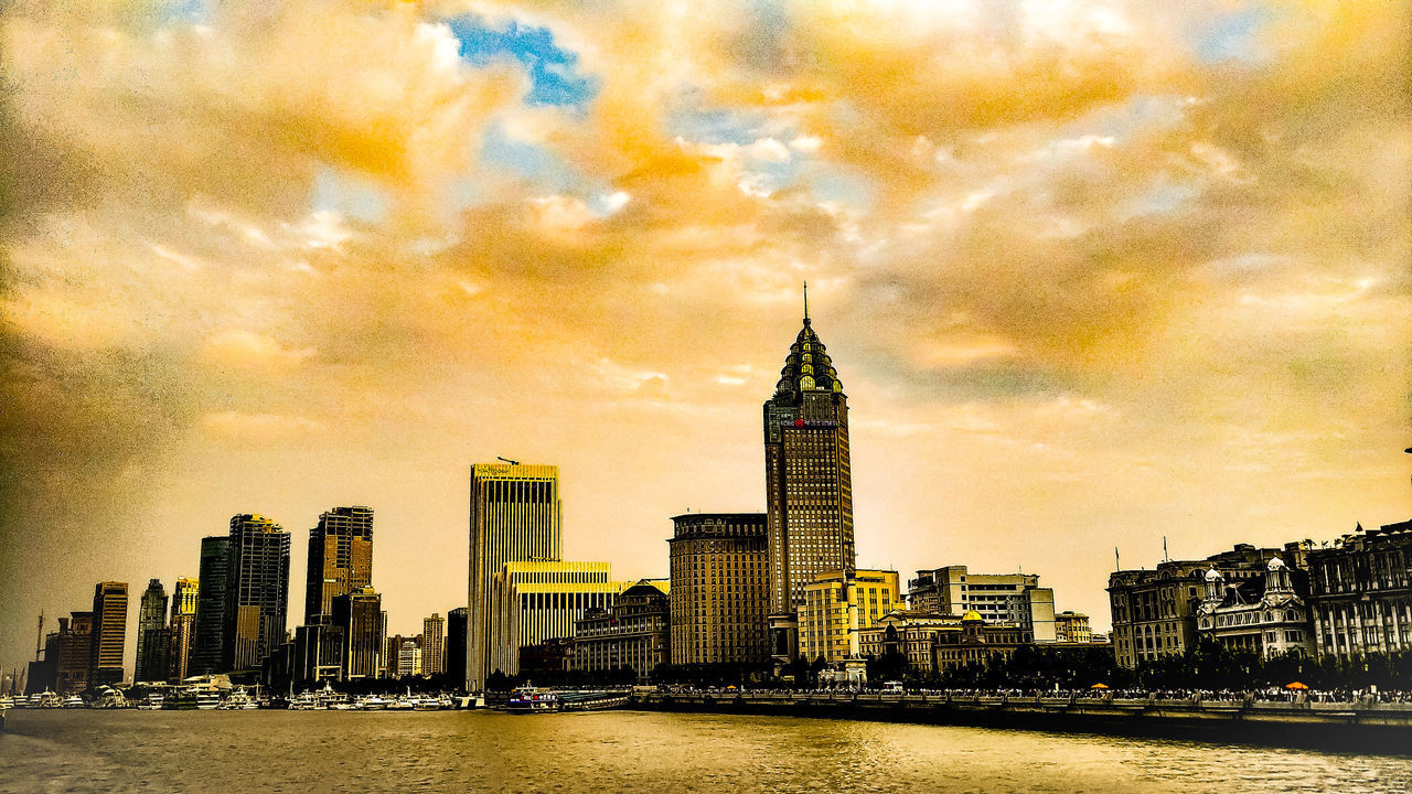 VIEW OF SKYSCRAPERS AT WATERFRONT