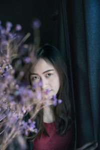 Portrait of smiling girl with flowers