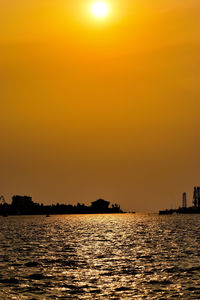 Scenic view of sea against clear sky during sunset