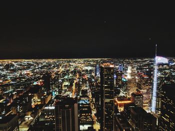 High angle view of illuminated city buildings at night