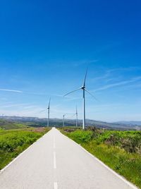 Empty road amidst landscape