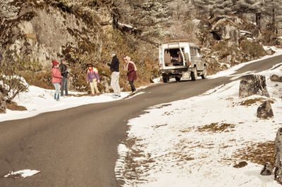 Group of people on road in winter