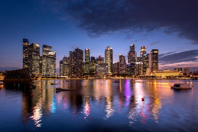 Illuminated city at waterfront