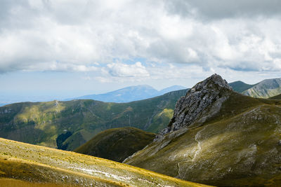 Scenic view of mountains against sky in montemonaco, marche italy