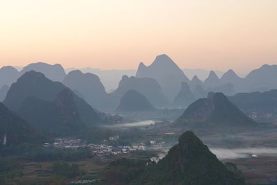 Scenic view of mountains against sky during sunset