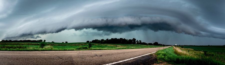 Panoramic view of storm clouds over field