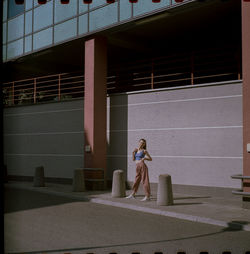 Rear view of woman walking on street