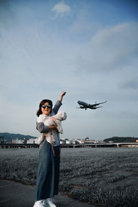 Portrait of man standing on land against sky