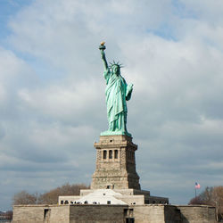 Low angle view of statue against cloudy sky