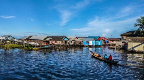 Man in boat against sky