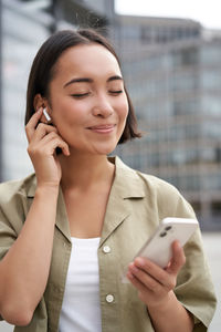 Young woman using mobile phone