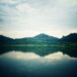 Reflection of trees in calm lake