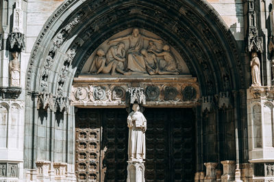 Low angle view of statue against temple