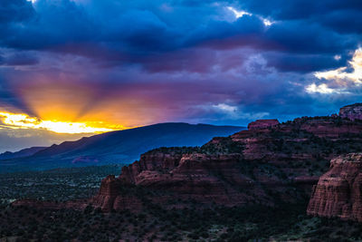 Scenic view of mountains against sky during sunset