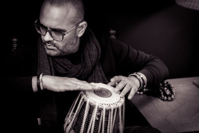 Close-up of man playing tabla