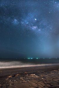 Scenic view of sea against sky at night