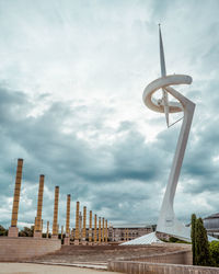 Low angle view of sculpture against cloudy sky