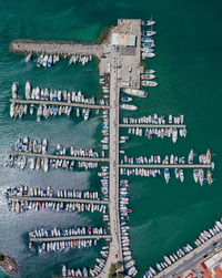 Aerial view of boats at harbor in sea