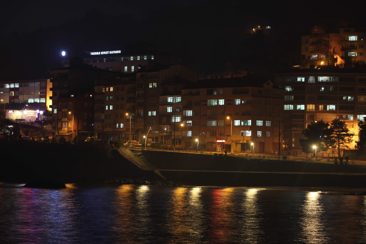 ILLUMINATED BUILDINGS AT NIGHT