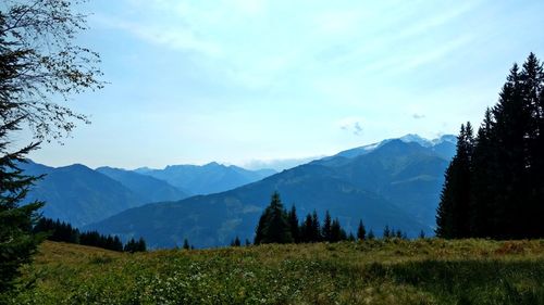 Scenic view of landscape and mountains against sky