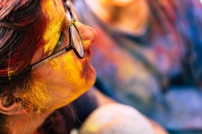 Close-up of woman covered with powder paint