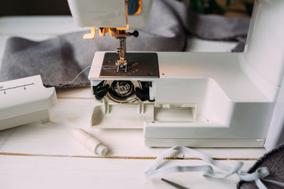 Sewing machine, accessories and fabric. cozy creative sewing process at home