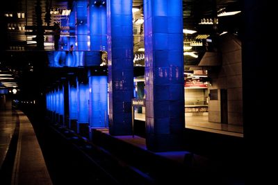 Narrow walkway along buildings at night