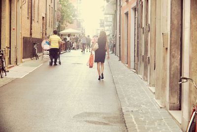 People walking on road in city