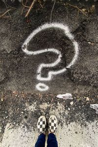 Low section of person standing on street