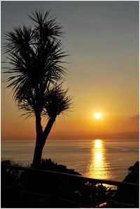 Scenic view of sea at sunset