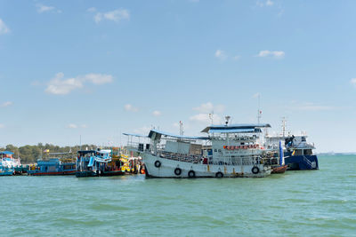 Ship moored on sea against sky