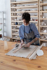 Portrait of young man working at table