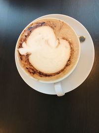 High angle view of cappuccino on table