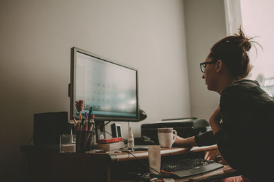 People working on table in office