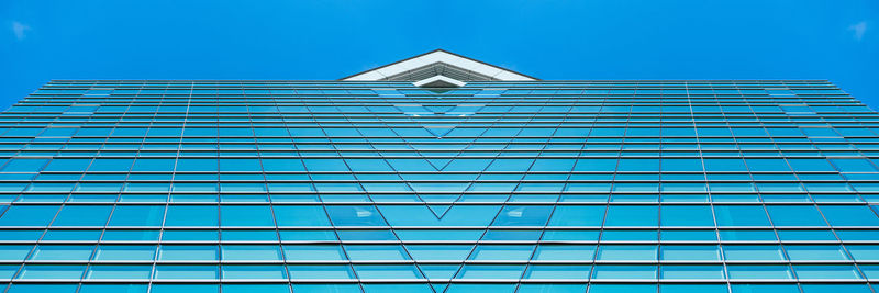 Low angle view of building against blue sky