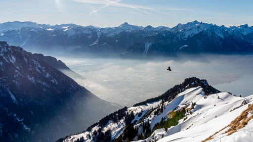 Scenic view of snowcapped mountains against sky