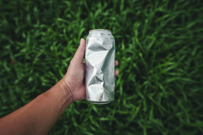 Cropped hand holding paper currency