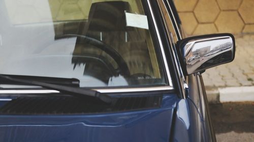 Reflection of car on side-view mirror