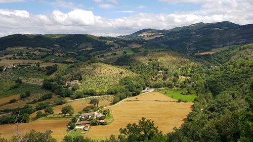 Scenic view of landscape and mountains against sky