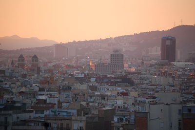 Cityscape against clear sky during sunset