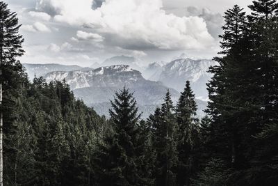 Scenic view of mountains against cloudy sky