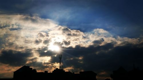 Low angle view of silhouette buildings against sky during sunset