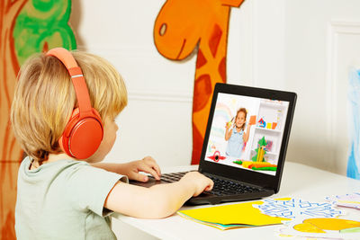 Woman using laptop at home