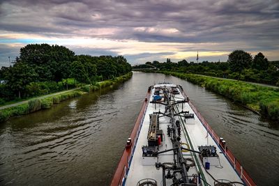 Scenic view of river against sky at sunset