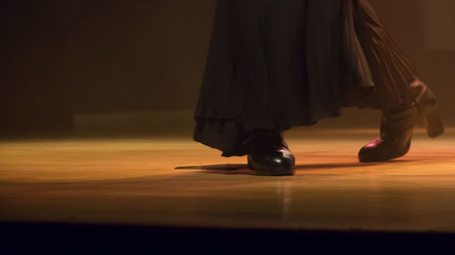 Low section of female dancer dancing on stage