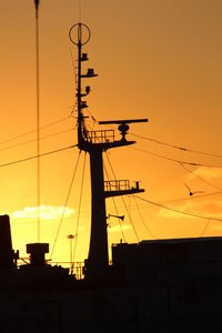 Silhouette of built structure at sunset