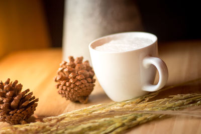 Close-up of coffee cup on table