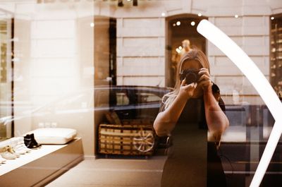 Woman photographing through smart phone