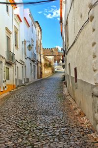 Narrow alley amidst buildings in city